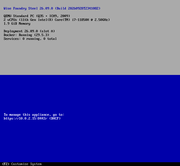 Steel Console main screen of a freshly deployed Wise Foundry Steel 26.10.0 appliance: its build, virtual hardware, deployment slot, Docker running and services on grey, and the address to manage it at on blue, with F2 and F12 in the footer